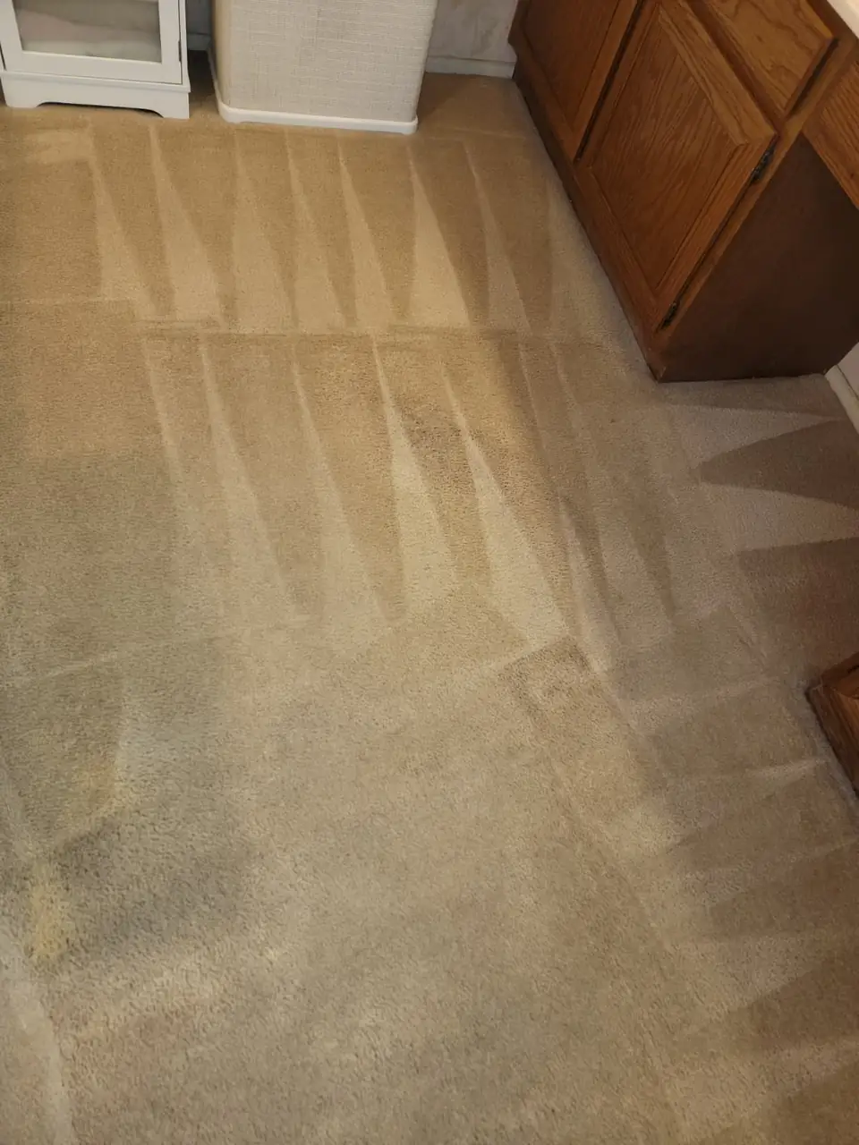 The same beige carpet after cleaning, the stains gone