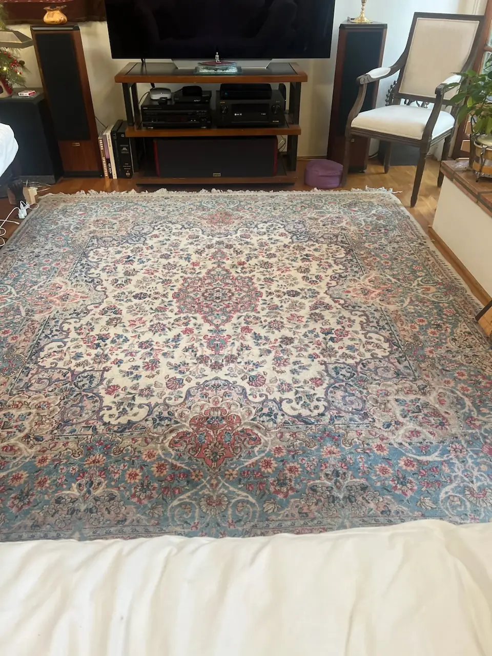 Large Persian wool rug in a bedroom